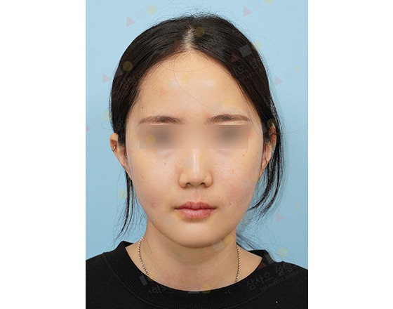 Woman with straight hair against blue background
