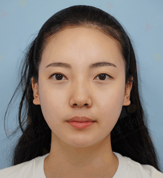Portrait of a woman with dark hair and headband.