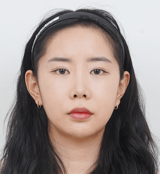 Person with long black hair wearing a headband.