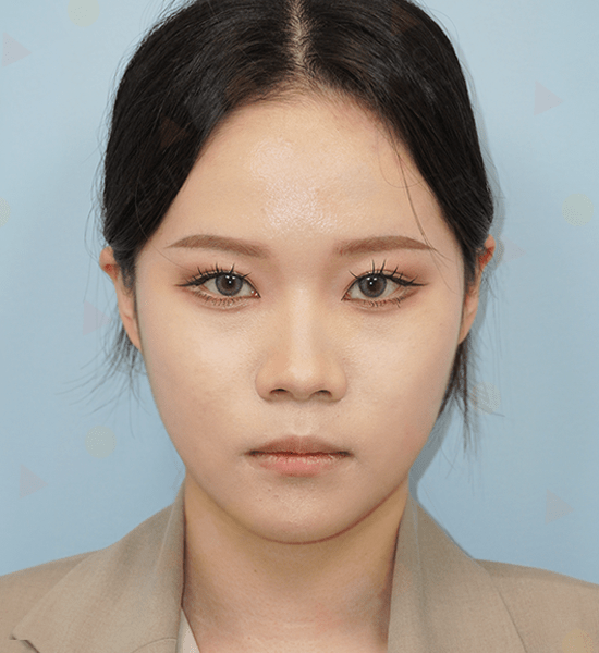 Portrait of a person with black hair and makeup.