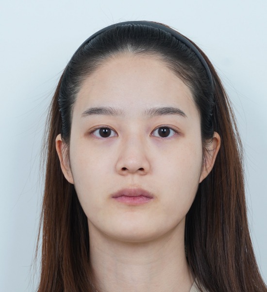 Woman with headband looking forward